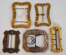 Five 19th century buckles, one being a long rectangular pinchbeck example repousse embossed with