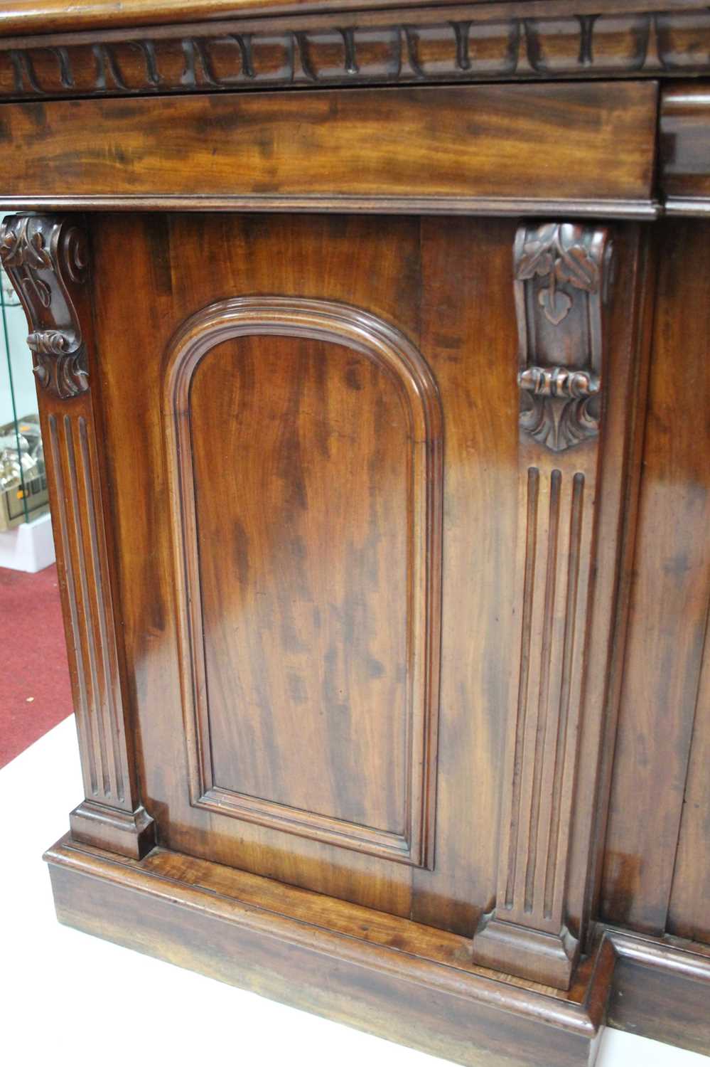 An early Victorian plum-pudding mahogany ledgeback sideboard, having floral carved detail, egg and - Image 4 of 5