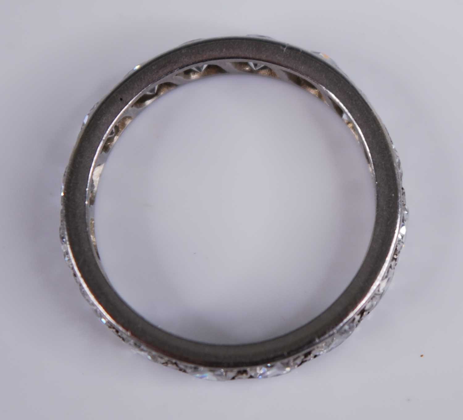 A white metal diamond full hoop eternity ring, grain set with 16 round brilliant cut diamonds, - Image 3 of 3