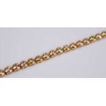 A contemporary 18ct yellow gold diamond bracelet, comprising 36 round brilliant cut diamonds in