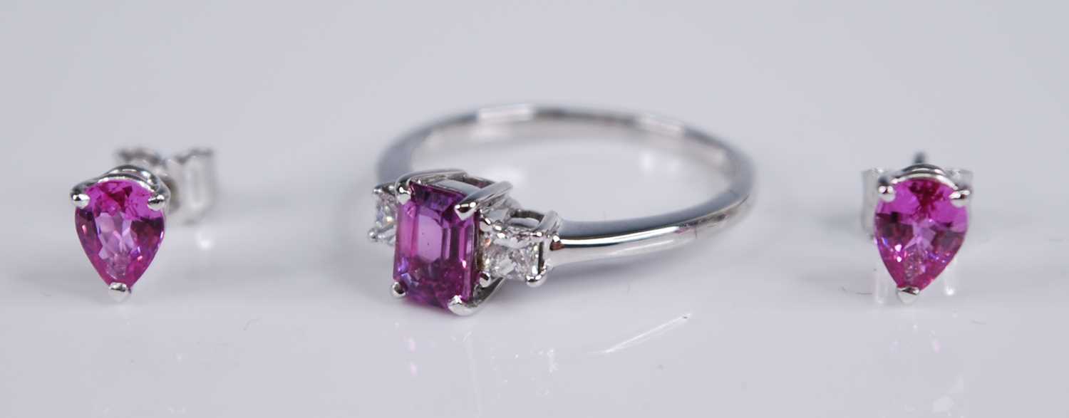 An 18ct white gold, pink sapphire and diamond three stone ring, the four-claw set emerald cut pink - Image 2 of 3
