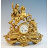 A late 19th century French gilt brass mantel clock, of good size, the white enamel Roman dial