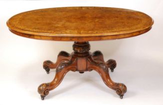A mid-Victorian figured walnut and floral satinwood inlaid oval pedestal tilt-top breakfast table,