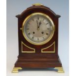 An early 20th century mahogany and brass mounted bracket clock in the Georgian style, having an