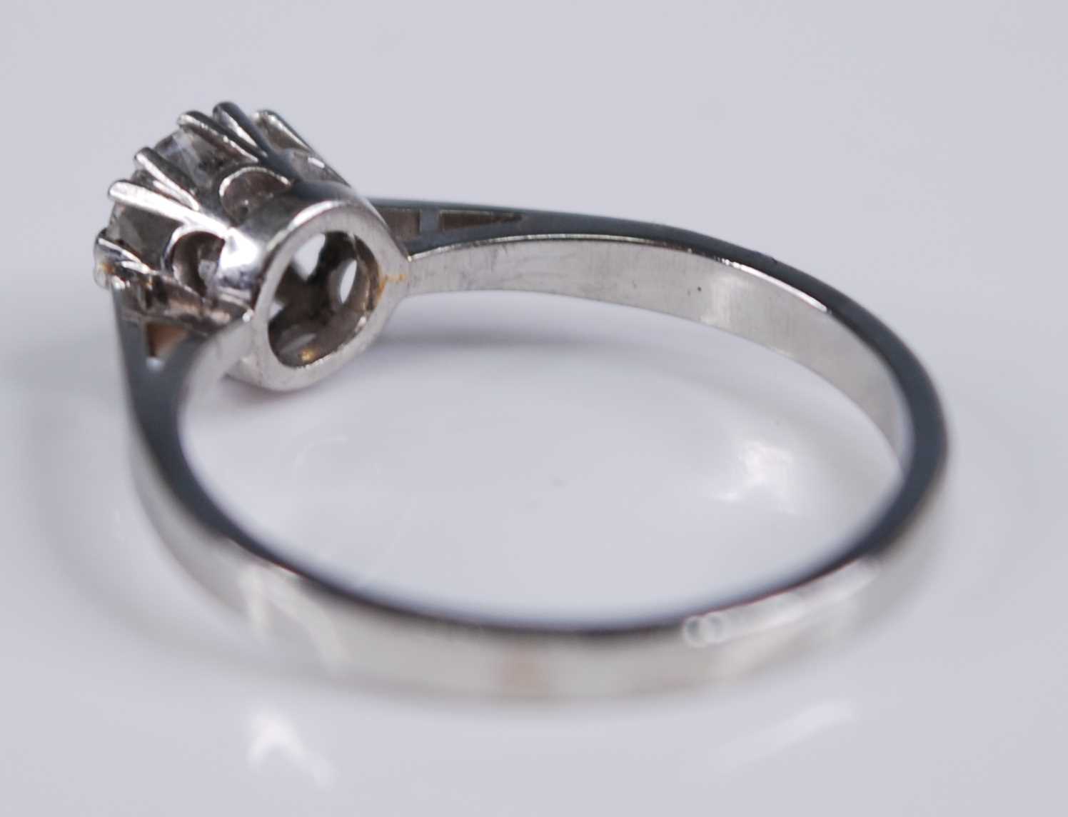 A white metal diamond solitaire ring, featuring a round brilliant cut diamond in a claw setting, - Image 4 of 4