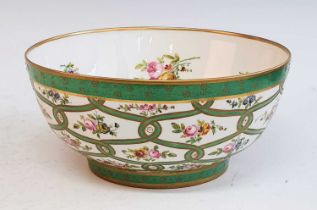 A Victorian Rockingham bowl, enamel decorated with floral sprays upon an apple green ground, printed