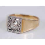 A gent's 18ct gold diamond solitaire ring, the old round cut in a carved white metal (probably