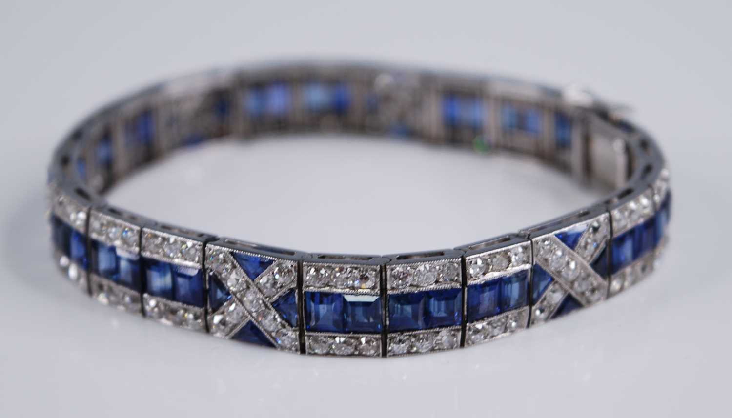 A white metal, sapphire and diamond Art Deco style articulated line bracelet, featuring 57 - Image 3 of 6