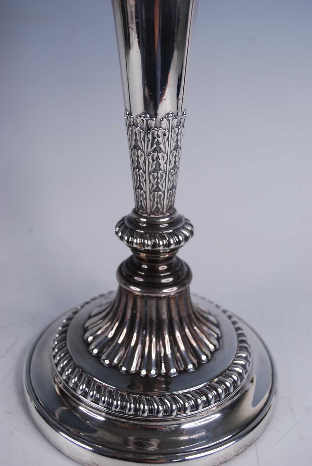 A pair of George III silver candlesticks, with matching plated three-light candelabra over, the - Image 3 of 4