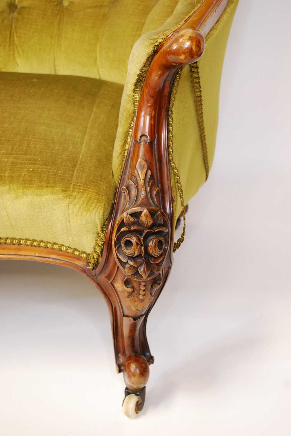 A mid-Victorian walnut and floral carved showframe double humpback settee, having intricate - Image 4 of 4