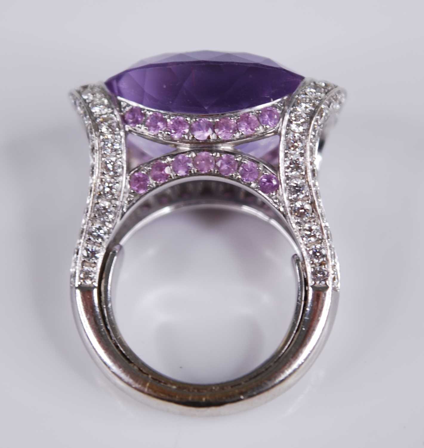 A contemporary French 18ct white gold, amethyst and diamond dress ring, arranged as a large oval cut - Image 5 of 6