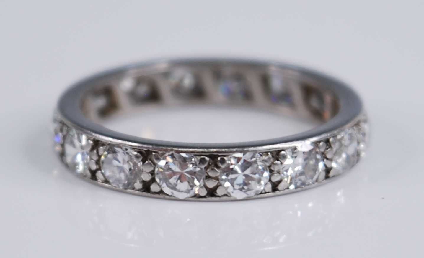 A white metal diamond full hoop eternity ring, grain set with 16 round brilliant cut diamonds, - Image 2 of 3