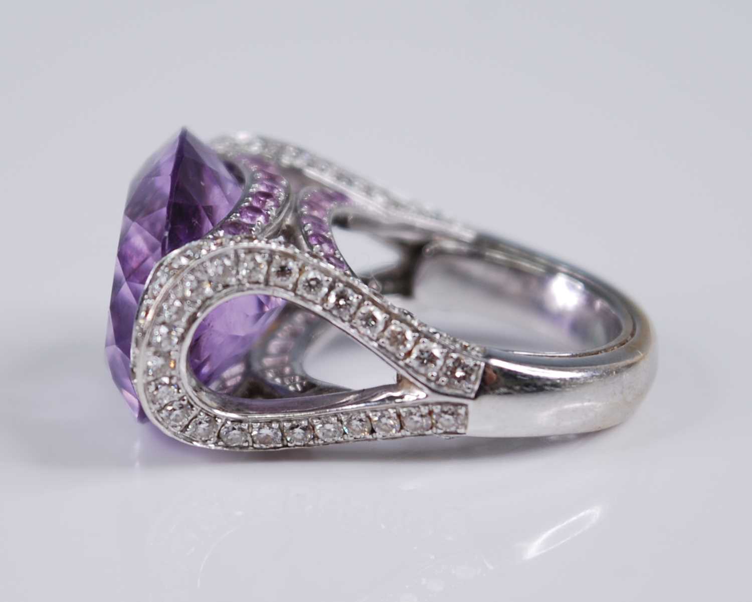 A contemporary French 18ct white gold, amethyst and diamond dress ring, arranged as a large oval cut - Image 4 of 6