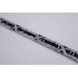 A white metal, sapphire and diamond Art Deco style articulated line bracelet, featuring 57