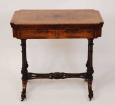 A mid-Victorian figured walnut and birds-eye maple inlaid foldover card table, having a baize
