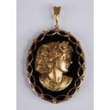 A Victorian style 9ct gold, black onyx and diamond set portrait pendant, as a profile portrait of