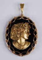 A Victorian style 9ct gold, black onyx and diamond set portrait pendant, as a profile portrait of