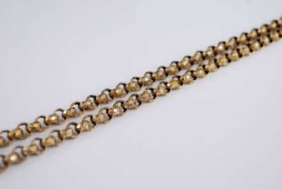 A yellow metal and engraved belcher link guard chain, each link with carved and raised star