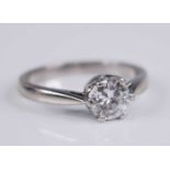 A contemporary white metal diamond solitaire ring, the six-claw set round brilliant cut weighing