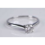 A contemporary 18ct white gold diamond solitaire ring, the four-claw set brilliant weighing approx