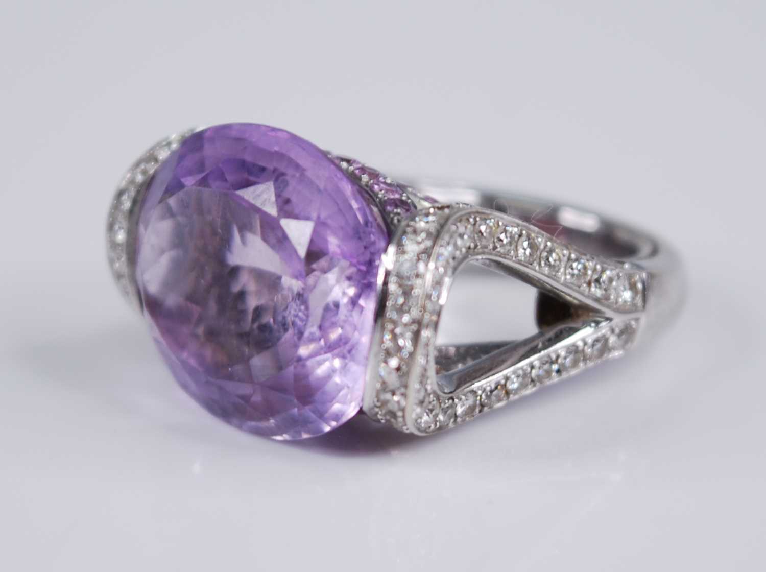 A contemporary French 18ct white gold, amethyst and diamond dress ring, arranged as a large oval cut - Image 3 of 6