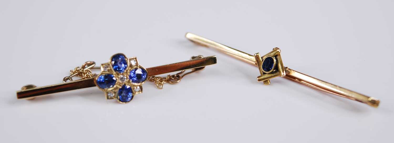 Two bar brooches, being a 9ct yellow gold, sapphire and diamond quatrefoil brooch, the four oval