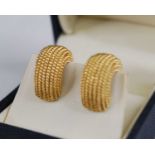 A pair of contemporary Italian 18ct gold earrings, of half hoop design with fine ropetwist bands,