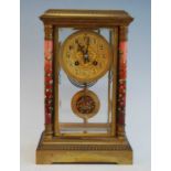 A circa 1900 French ormolu and enamel decorated four glass mantel clock, the circular Arabic dial