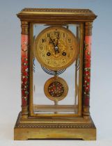 A circa 1900 French ormolu and enamel decorated four glass mantel clock, the circular Arabic dial