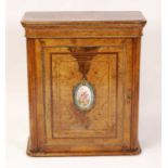 A mid-Victorian figured walnut round cornered pier cabinet, with flower head gilt metal detail,