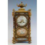 An early 20th century French ormolu and champleve enamel mantel clock, the convex white enamel Roman