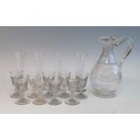 A Regency glass claret jug, wheel engraved with trailing vines, h.28cm, together with a set of
