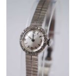 A lady's Tudor Royal 9ct gold bracelet watch, having a signed silvered dial with quarter Arabic