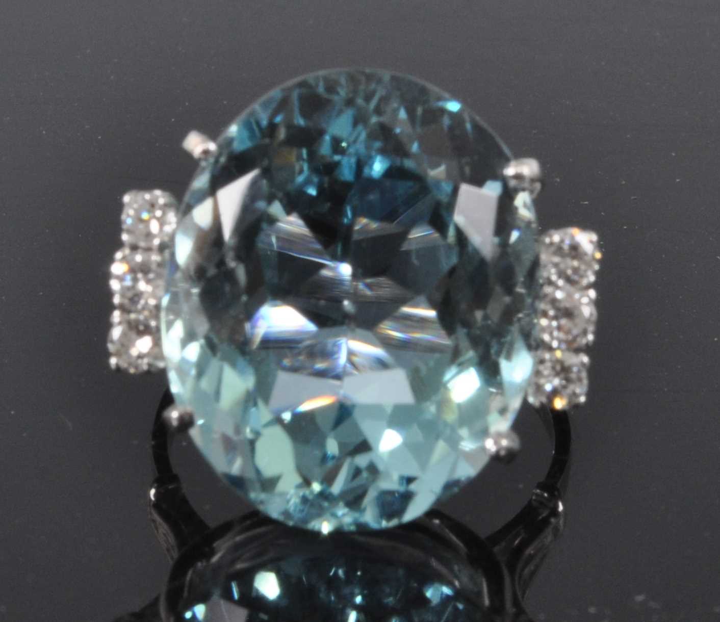 A white metal, aquamarine and diamond ring, comprising a centre oval aquamarine in a four claw - Image 2 of 7
