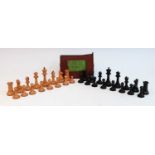 A late 19th century Jacques Staunton boxwood and ebony chess set, the rooks and knights bearing a