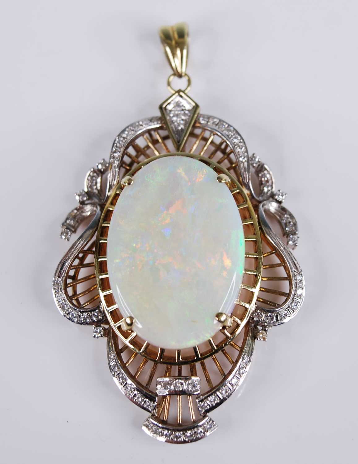 A yellow and white metal, opal and diamond openwork pendant, featuring a centre oval opal cabochon - Image 5 of 5