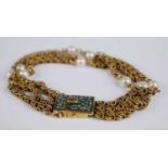 A vintage 18ct gold triple Byzantine link bracelet, each arranged as four sections dispersed with