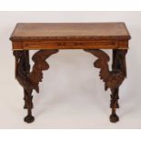 A circa 1900 carved oak hall table, having egg and dart carved top edge over forelegs carved as