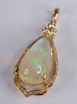 An 18ct gold Ethiopian opal set pendant, the large three-claw set cabochon opal weighing approx 8
