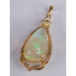 An 18ct gold Ethiopian opal set pendant, the large three-claw set cabochon opal weighing approx 8