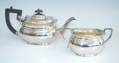 A mid-20th century silver teapot and sugar duo, each piece of oval bombe form to a stepped foot