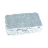 A Victorian silver snuff box, of shaped rectangular form, all-over finely scroll engraved with