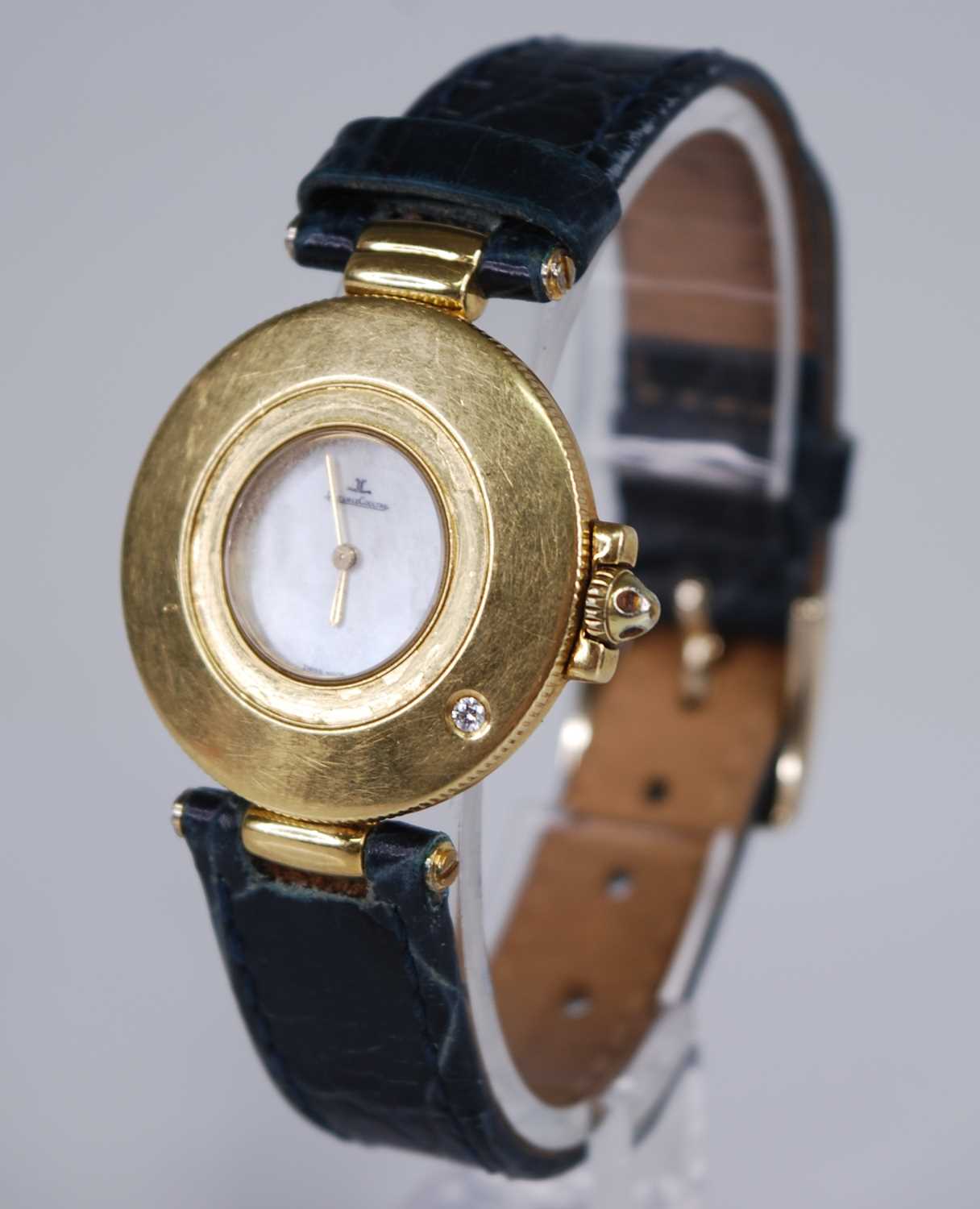 A lady's 18ct gold Jaeger LeCoultre quartz wristwatch, having a signed mother of pearl dial, diamond