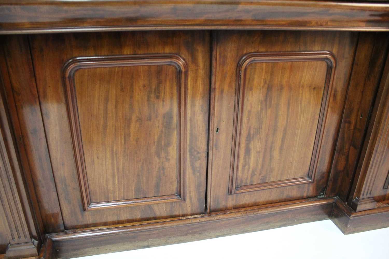 An early Victorian plum-pudding mahogany ledgeback sideboard, having floral carved detail, egg and - Image 5 of 5