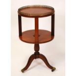 A circa 1900 satinwood circular book table, having a pierced brass gallery, chequer line inlay,