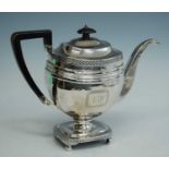 A George III silver pedestal teapot, of faceted oblong form to a pedestal rectangular gadrooned base
