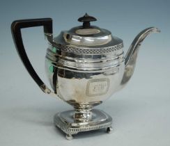 A George III silver pedestal teapot, of faceted oblong form to a pedestal rectangular gadrooned base