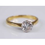 An 18ct gold diamond solitaire ring, the eight-claw set round brilliant cut diamond weighing