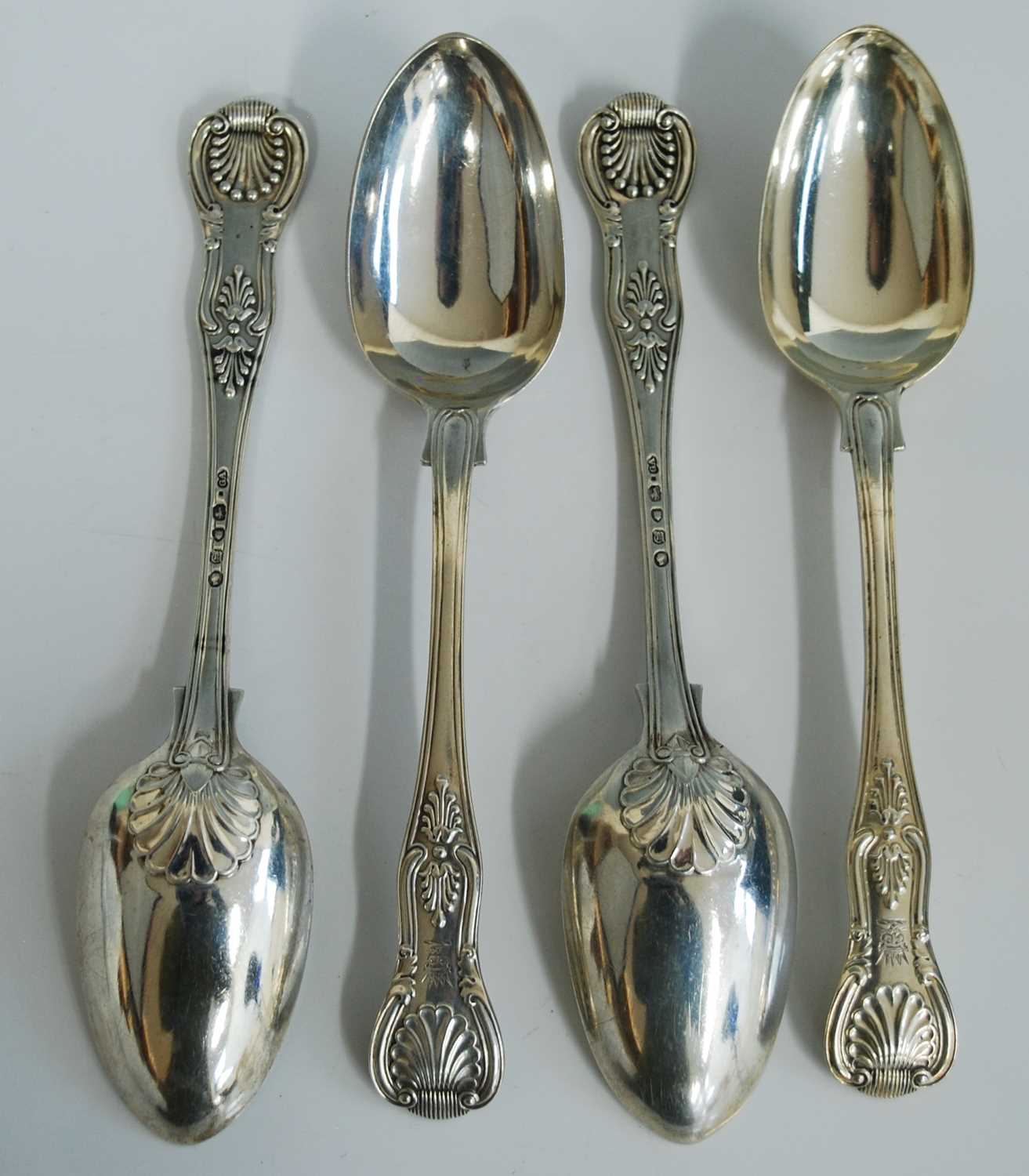 A set of four Victorian silver tablespoons, in the Kings Hourglass pattern with engraved crowned