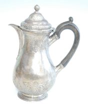 A George II silver hot water pot, of baluster form and repousse decorated with shells and foliate